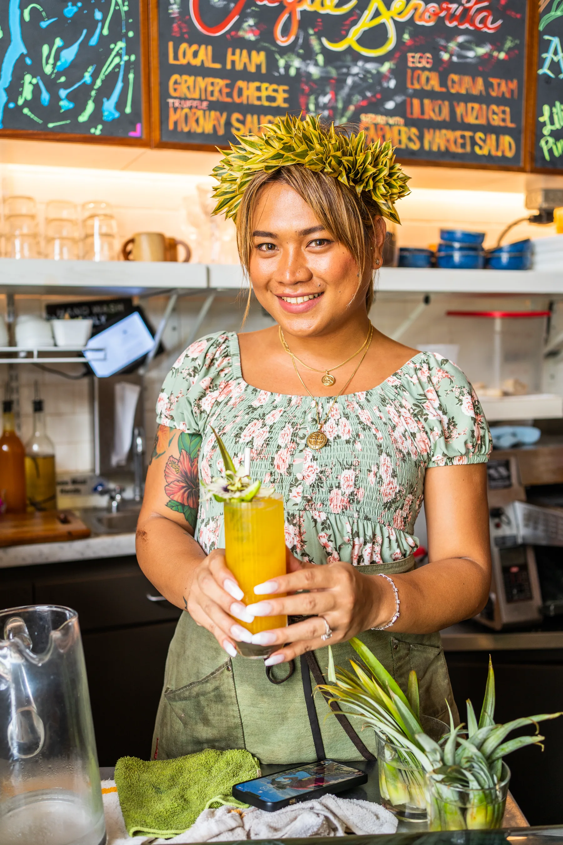 Castro’s team member serving a tropical drink